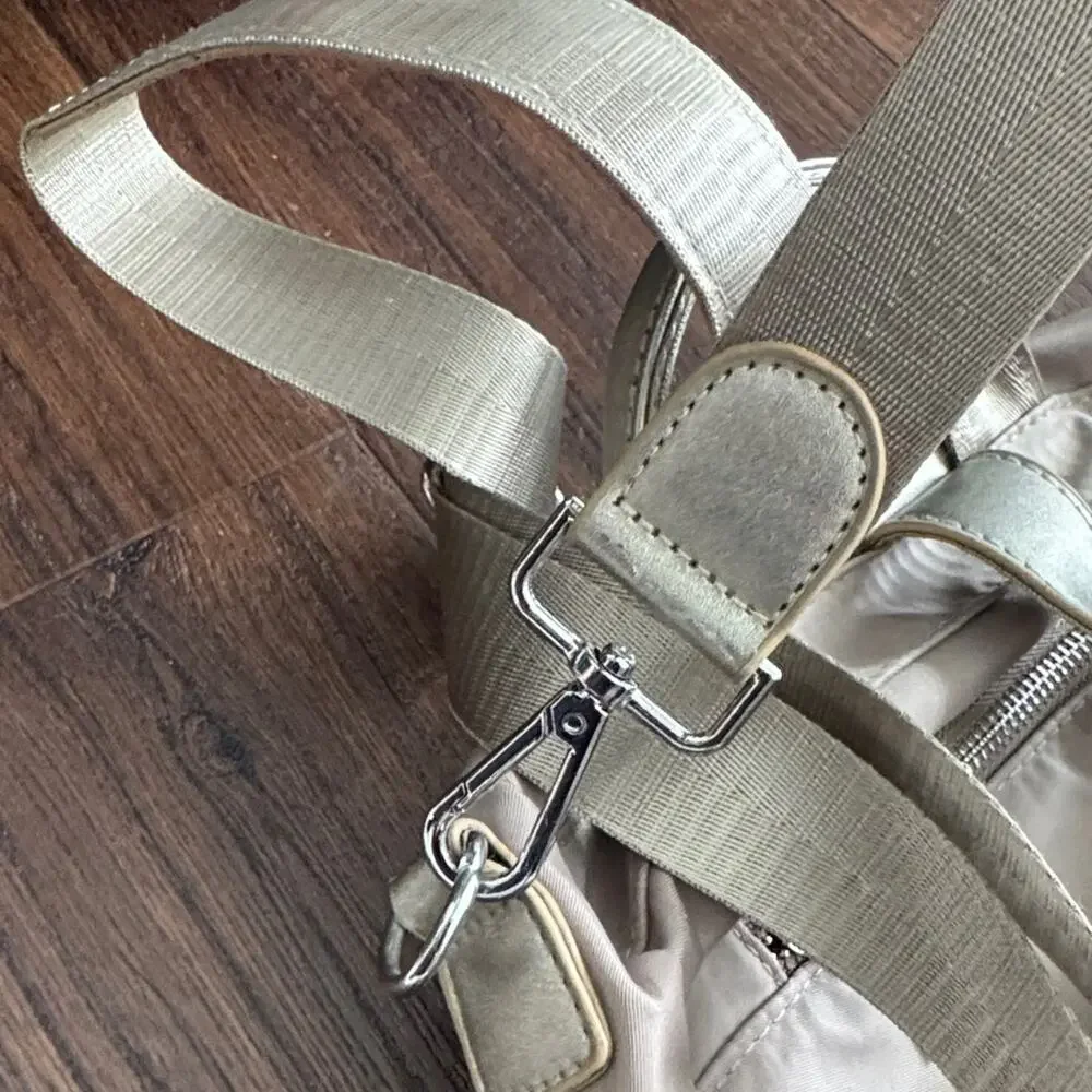 Neutral Taupe Woman’s Backpack with Metallic Accent and many zipper pockets. - Picture 5 of 13